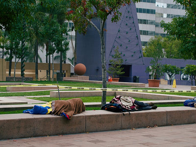 Homeless people sleeping in Pershing Square in Downtown Los Angeles