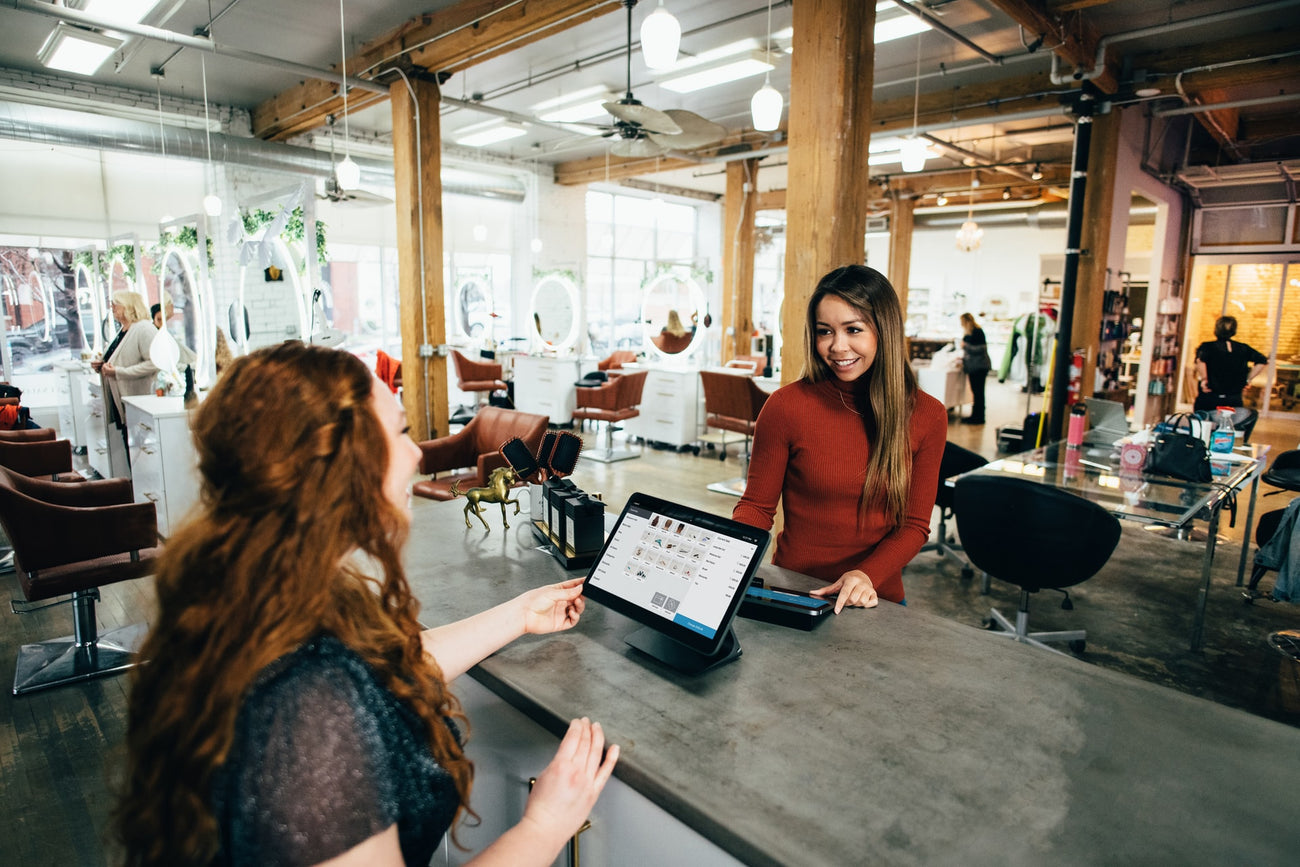 Employees talking at Makeup Counter